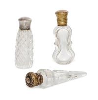 Three Cut and Molded Glass Scent Bottles, 19th/20th Century, of various forms and sizes.