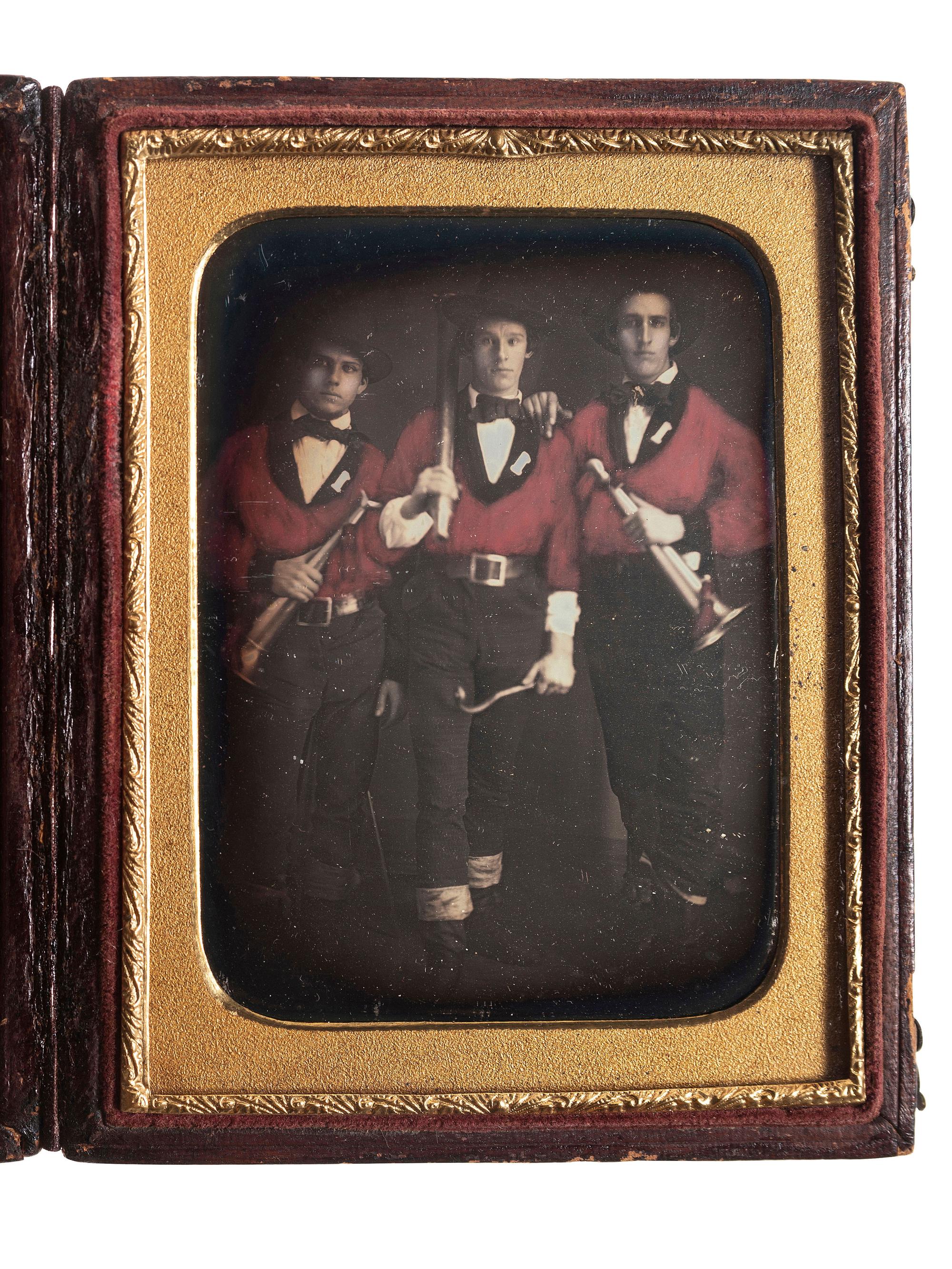[EARLY PHOTOGRAPHY]. A group of 2 hand-tinted daguerreotypes of firefighters, including quarter plate and sixth plate images.
