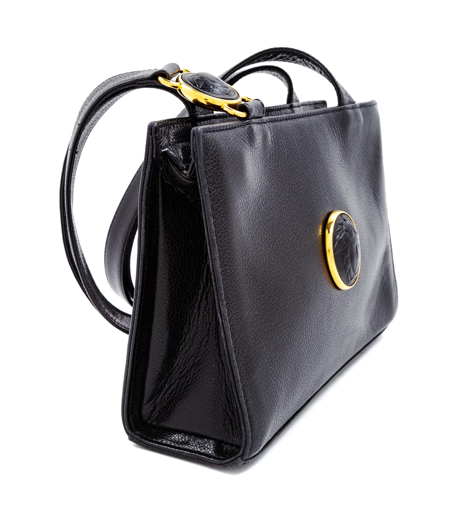 A Gianni Versace Black Leather Medusa Medallion Shoulder Bag, 6.25" H x 9.25" W x 2.75" D; Strap drop: 19.25".