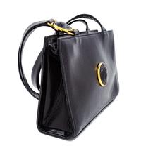 A Gianni Versace Black Leather Medusa Medallion Shoulder Bag, 6.25" H x 9.25" W x 2.75" D; Strap drop: 19.25".