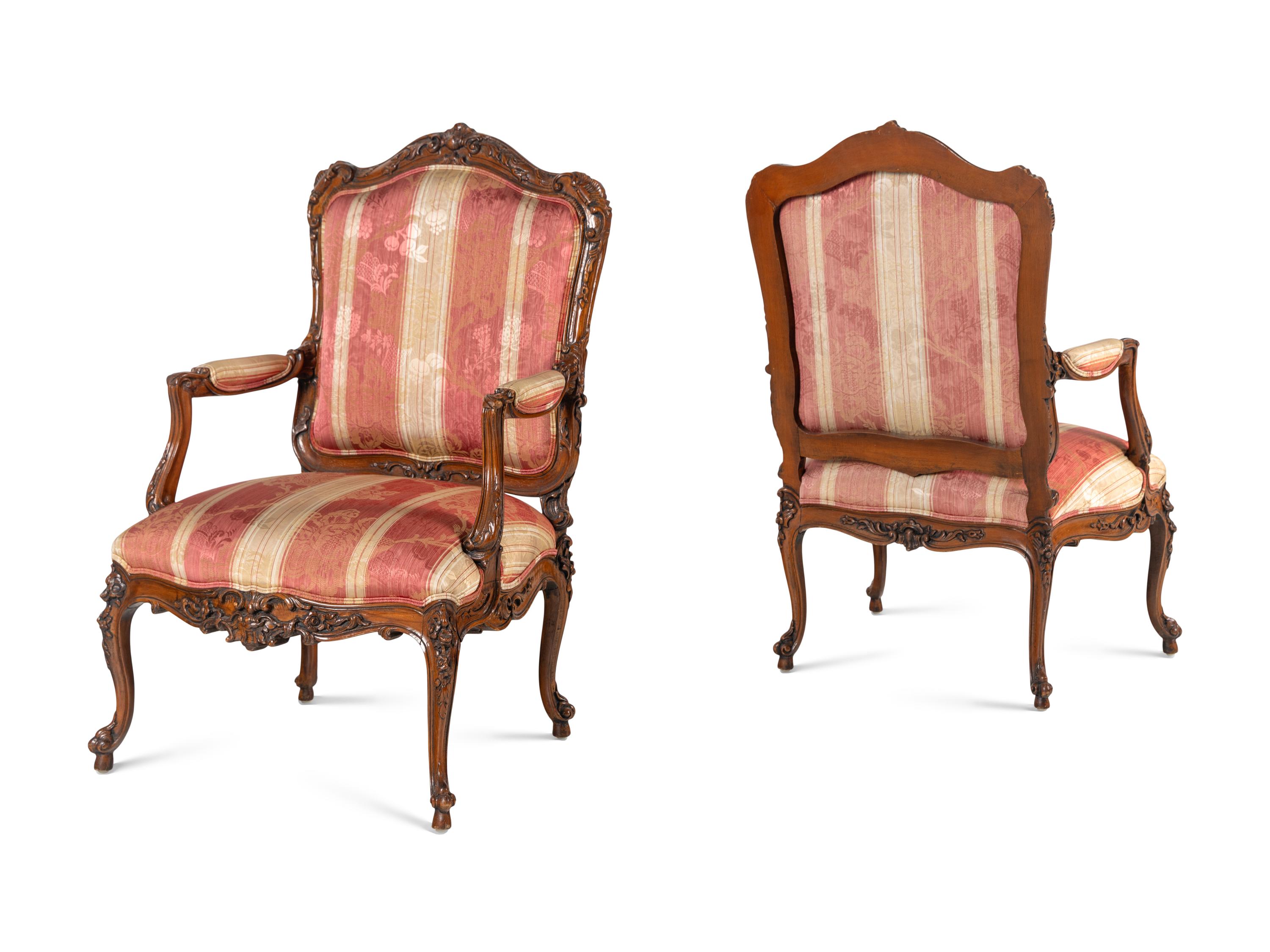 A Pair of Louis XV Style Walnut Fauteuils