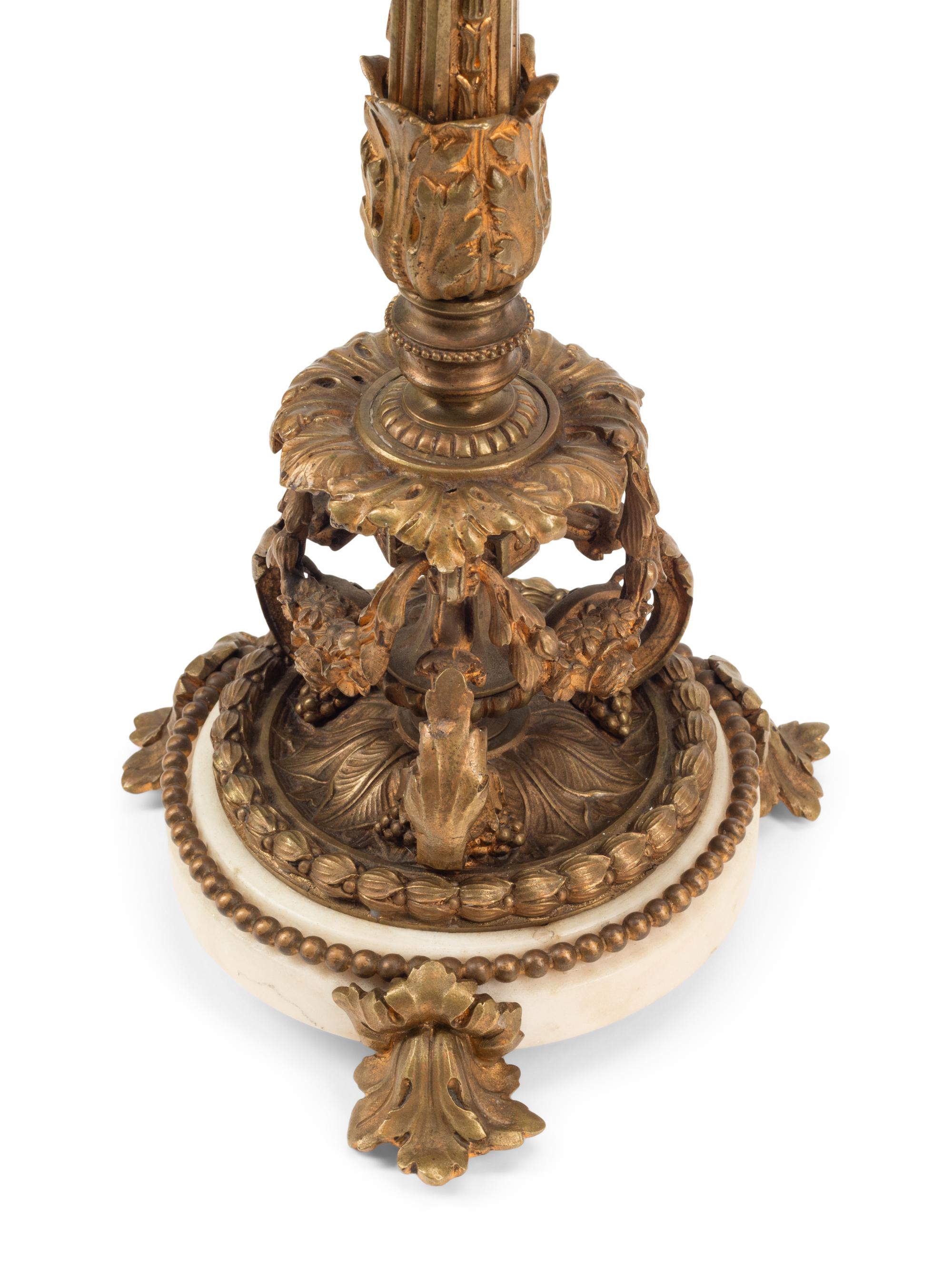 A Pair of Continental Gilt Bronze and Marble Candlesticks