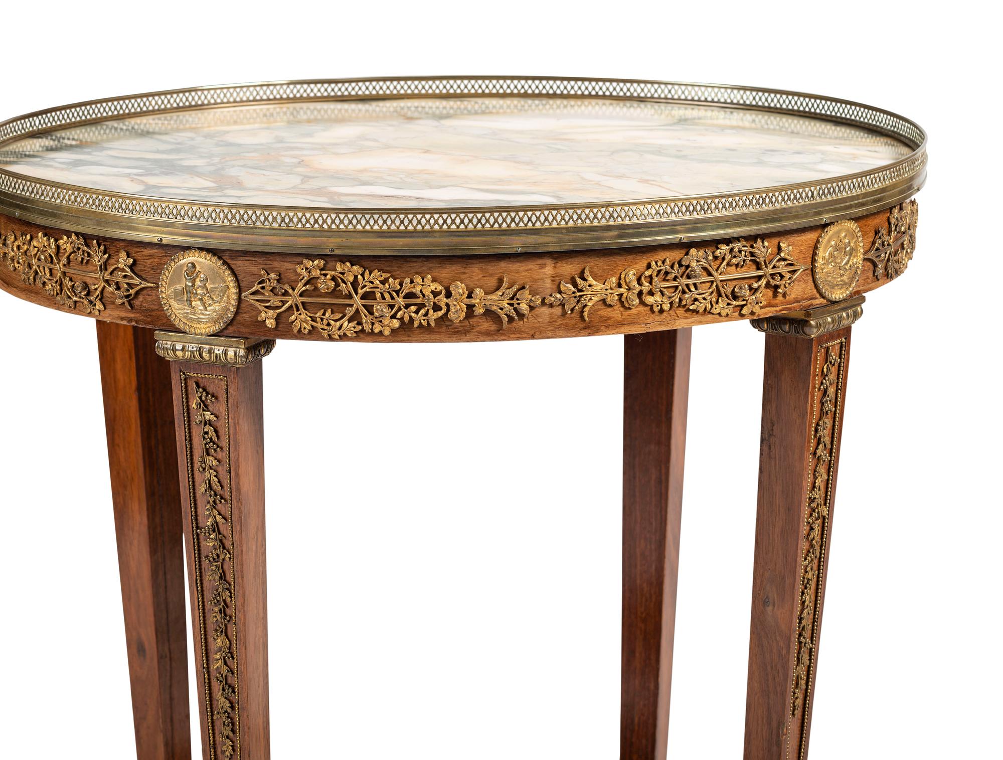 A Louis XVI Style Gilt Bronze Mounted Marble Top Mahogany Guéridon