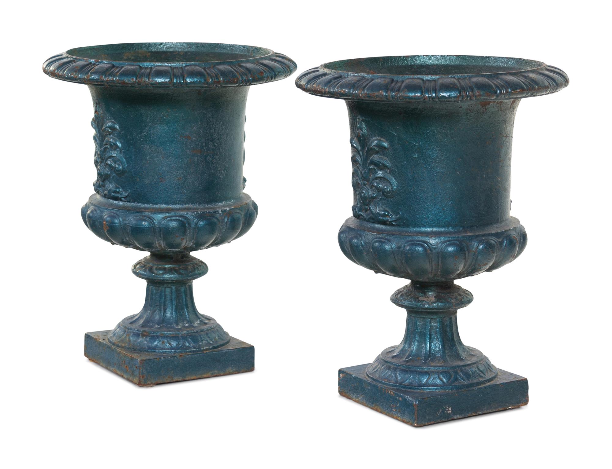 A Pair of Painted Iron Garden Urns