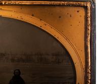 [EARLY PHOTOGRAPHY]. LAWRENCE, Martin M., photographer. Whole plate ambrotype of a man posed in front of Niagara Falls. New York, NY: ca 1853-1860.