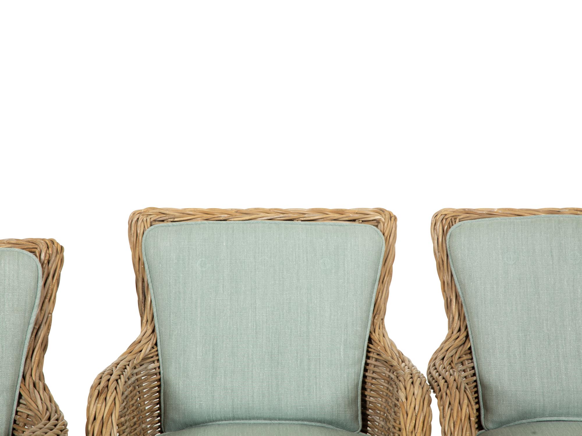 A Set of Four Rattan Armchairs with Seat and Back Cushions