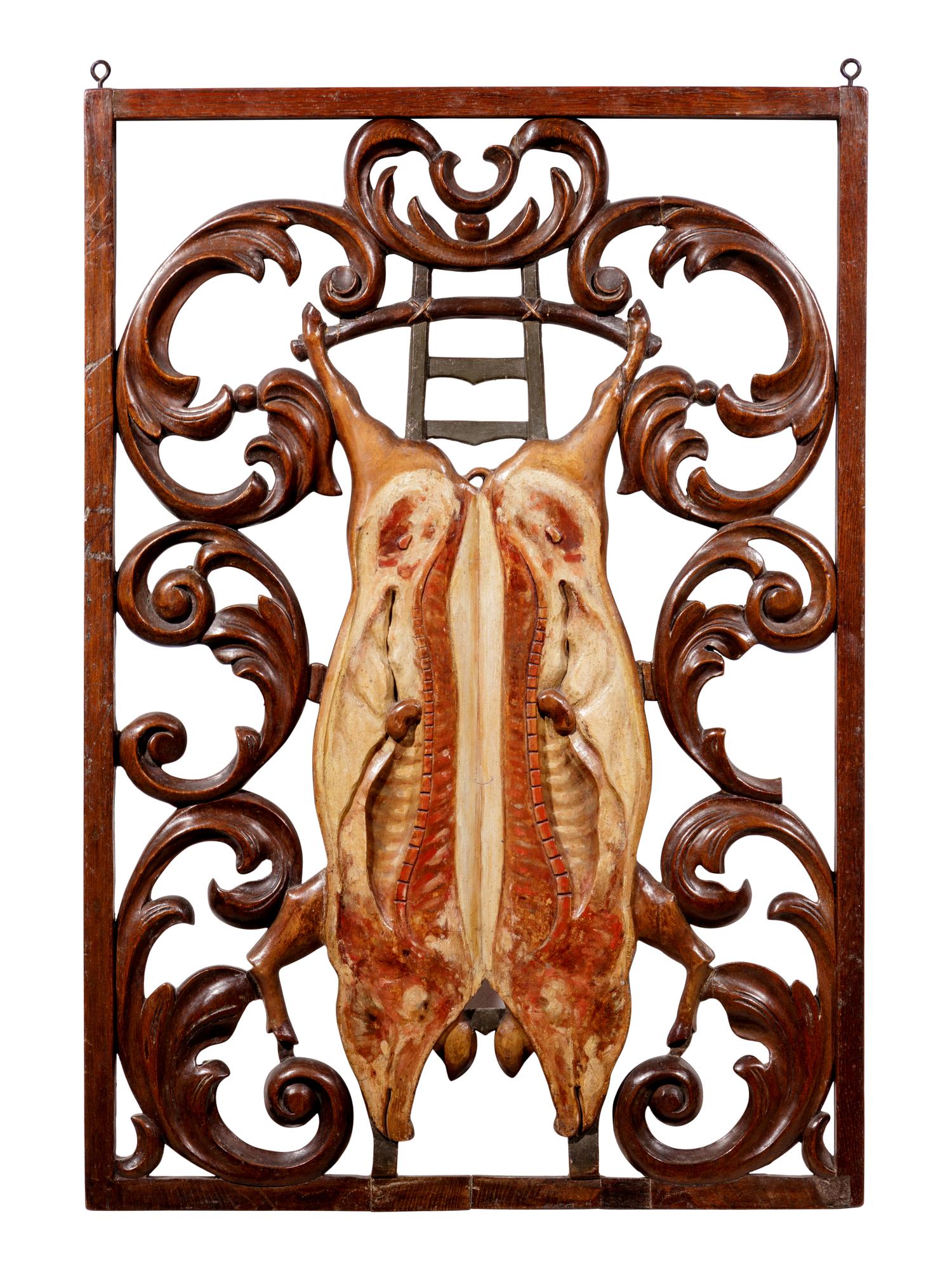 A Continental Carved and Polychrome Decorated Two Sided Butcher's Trade Sign