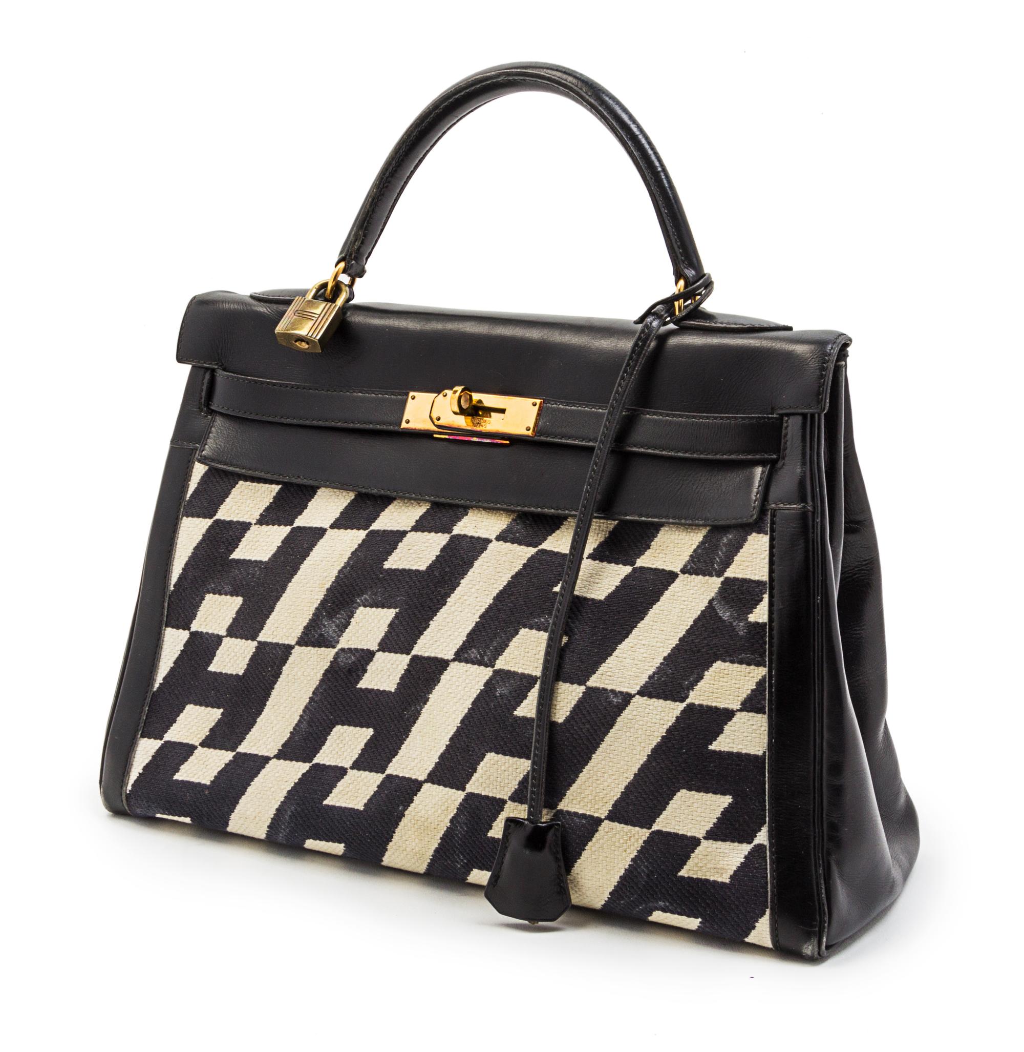 A Rare Hermes 35cm Ulysses Black Leather and Ivory Canvas Kelly Bag, 13 x 9 x 5 inches.