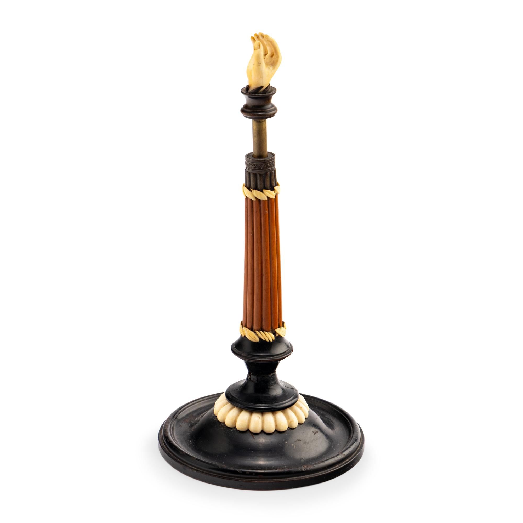 An Austrian Carved and Parcel-Ebonized Columnar Adjustable Quill Stand