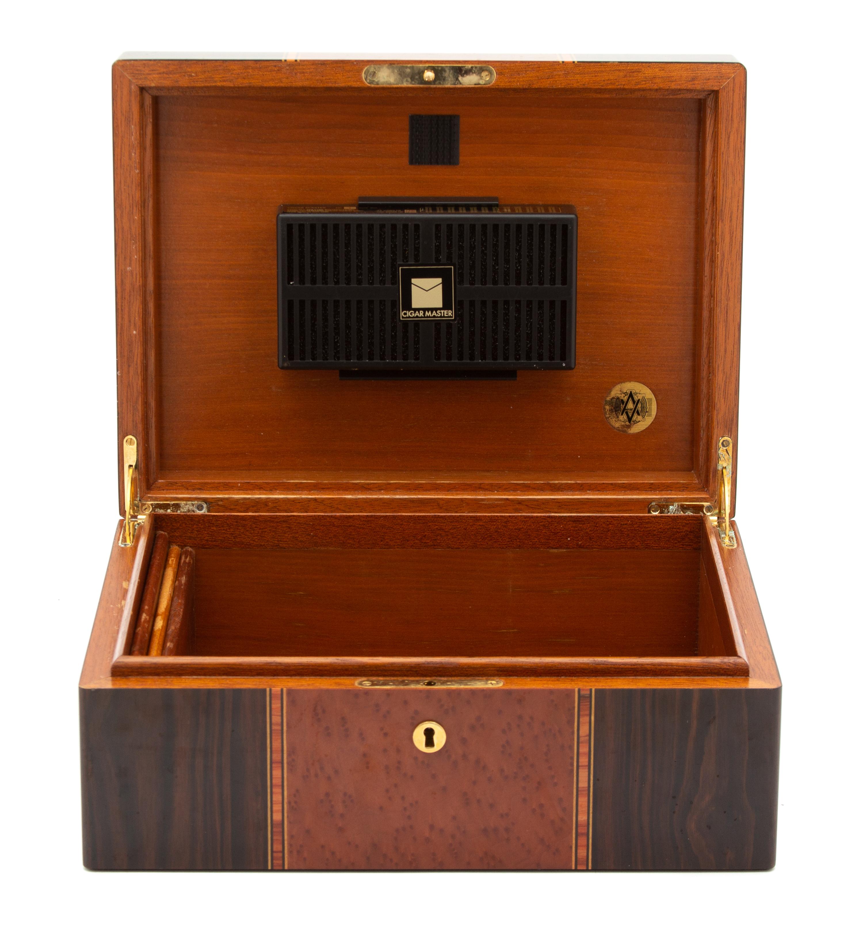 Three Wood Humidors Height of largest 5 1/4 x width 12 1/8 x depth 9 1/8 inches. — 20TH CENTURY