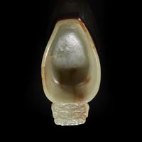 A Chinese pale celadon jade archaistic libation cup and a bronze rabbit seal 玉匜与铜兔印章一组 The jade 17th/18th Century, the seal possibly Yuan dynasty ?????????? ??????