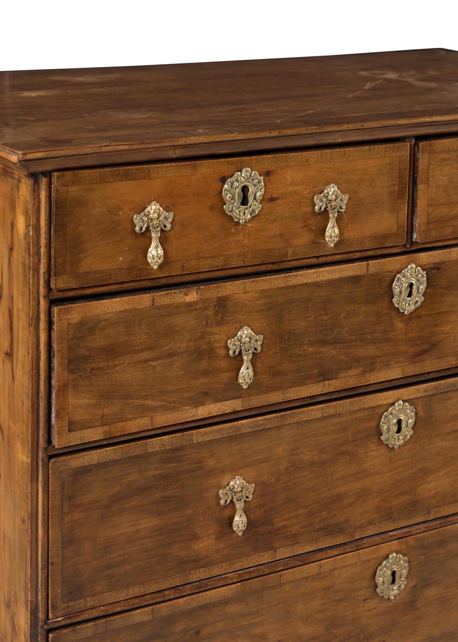 A George II Walnut and Mahogany Chest of Drawers