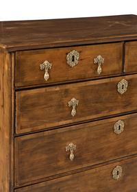 A George II Walnut and Mahogany Chest of Drawers