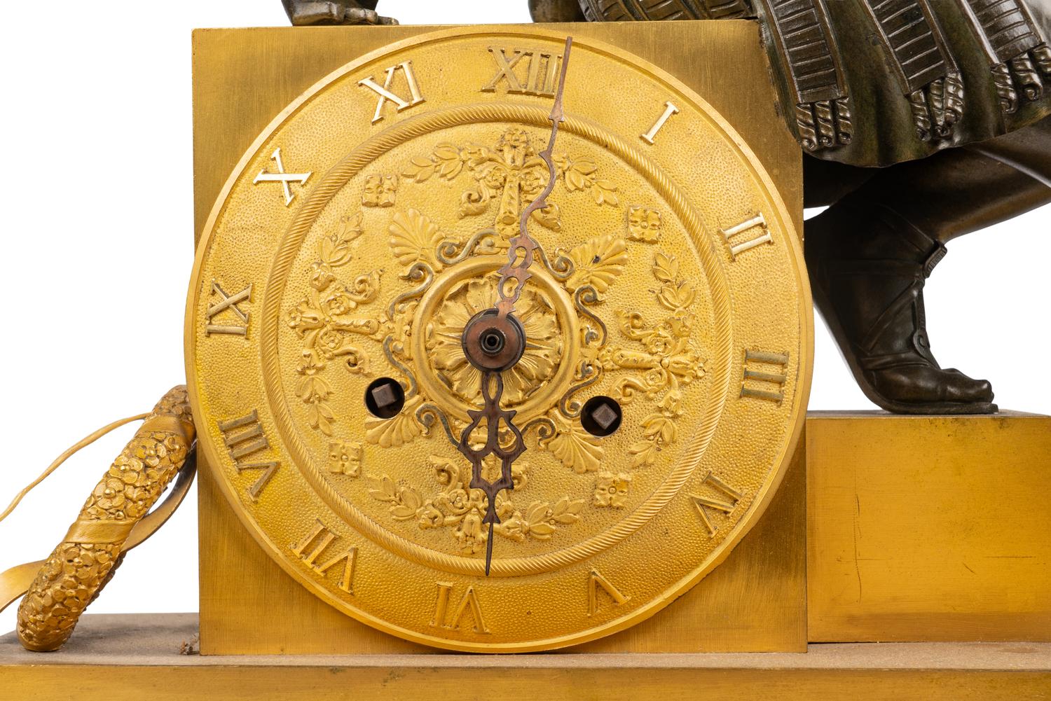 An Empire Gilt and Patinated Bronze Figural Mantel Clock