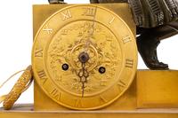 An Empire Gilt and Patinated Bronze Figural Mantel Clock