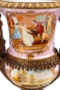 A Pair of Sèvres Style Gilt Bronze Mounted Porcelain Urns