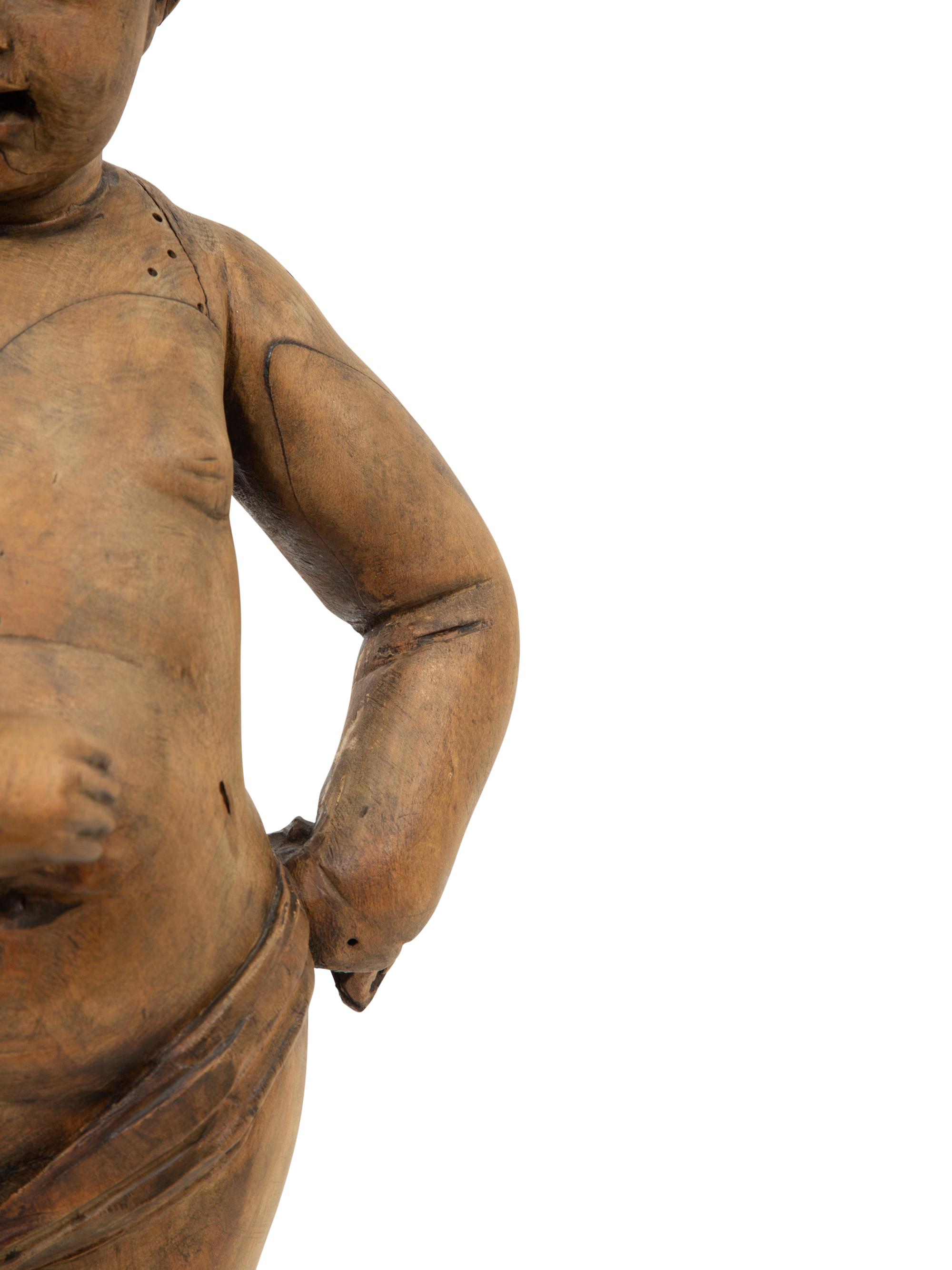 A Flemish Carved Wood Putto