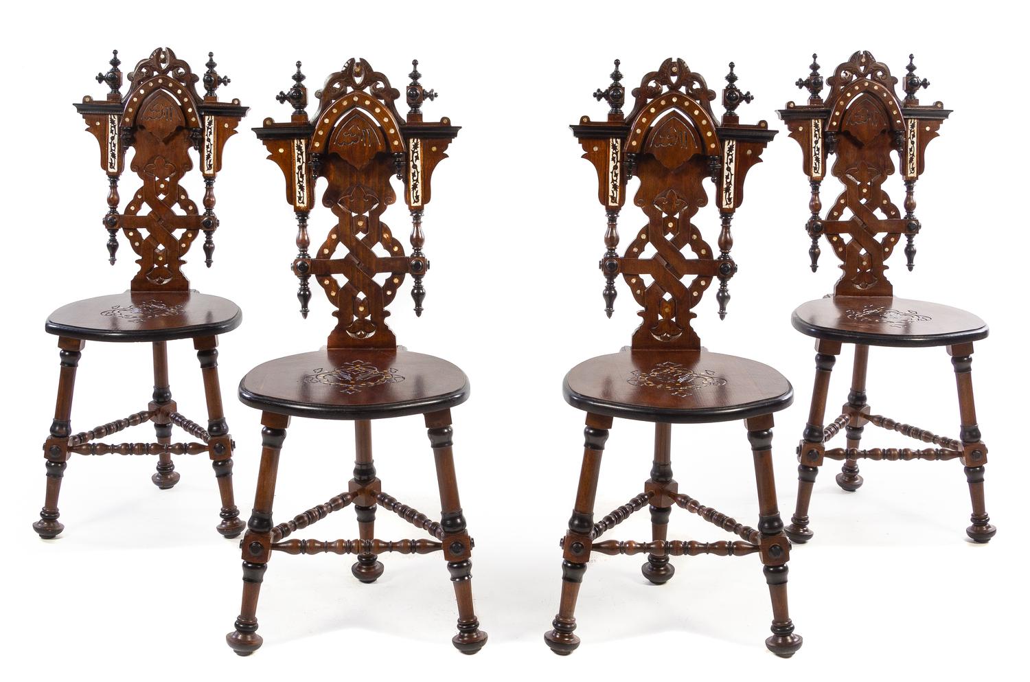 A Set of Four Continental Parcel Ebonized and Mother-of-Pearl Inlaid Walnut Hall Chairs Height 39 1/2 inches. — 20TH CENTURY
