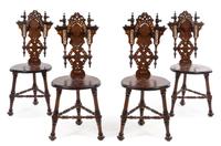 A Set of Four Continental Parcel Ebonized and Mother-of-Pearl Inlaid Walnut Hall Chairs Height 39 1/2 inches. — 20TH CENTURY