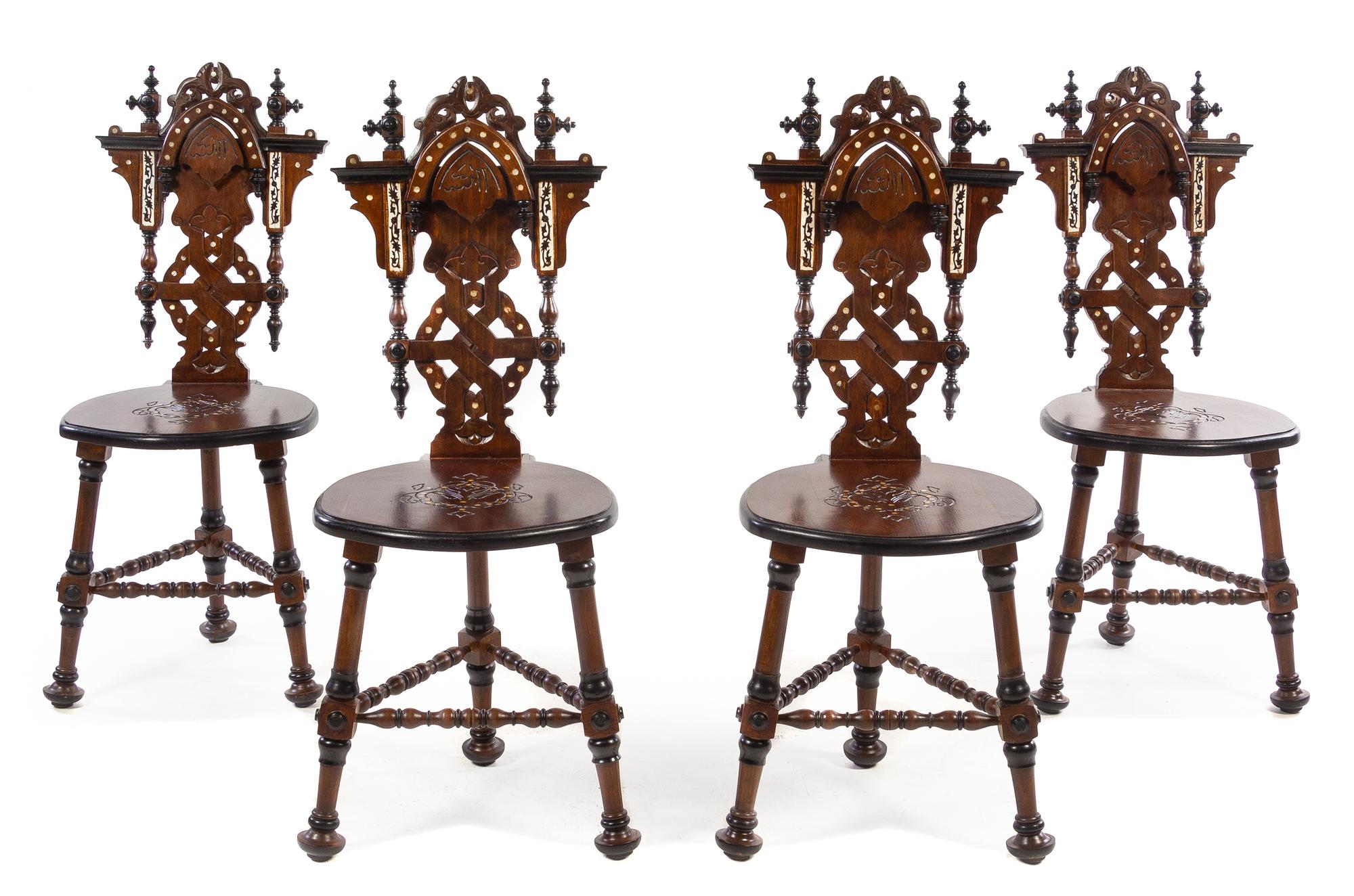 A Set of Four Continental Parcel Ebonized and Mother-of-Pearl Inlaid Walnut Hall Chairs Height 39 1/2 inches. — 20TH CENTURY