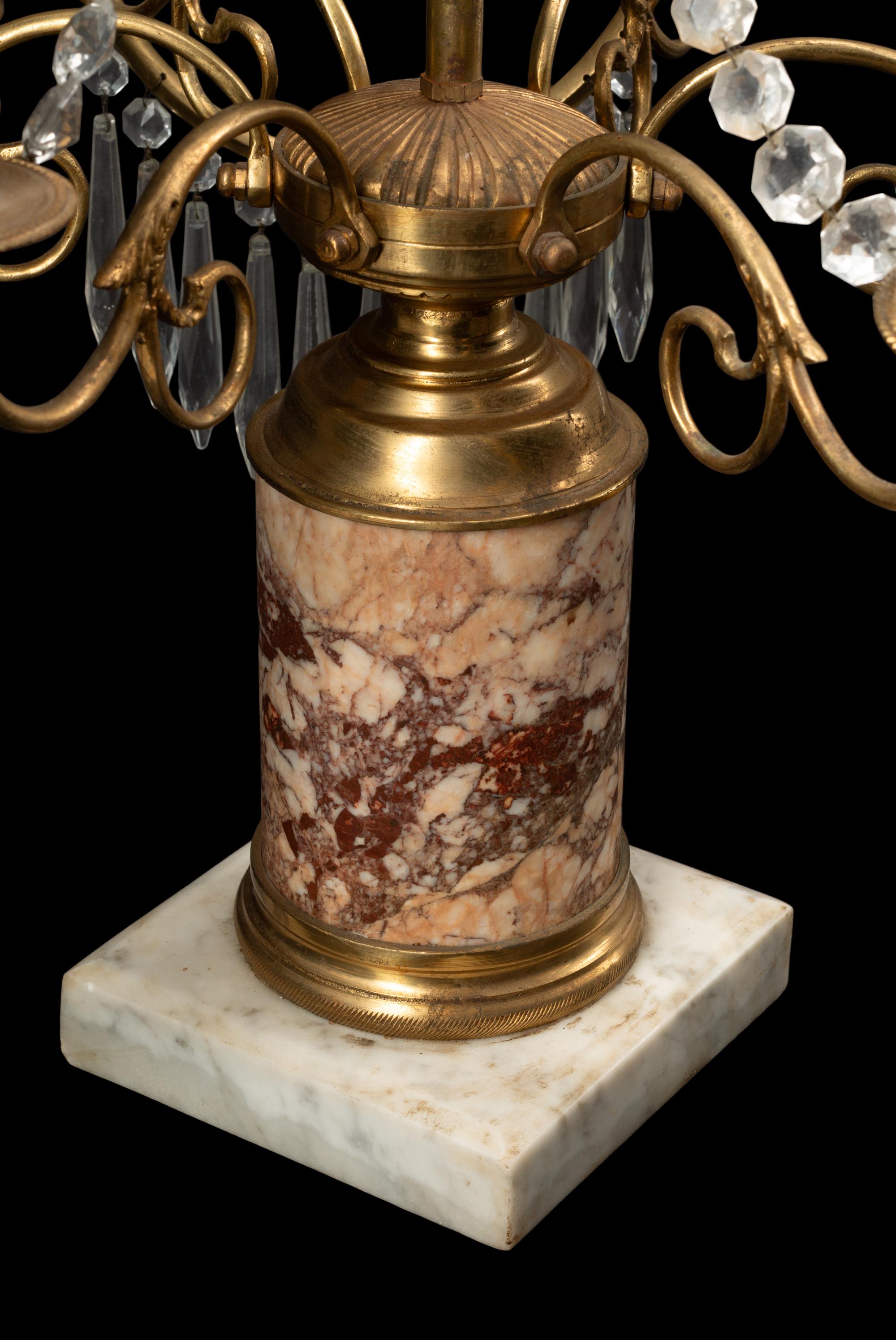 A Near Pair of Baltic Style Gilt Bronze, Marble and Cut Glass Six-Light Candelabra