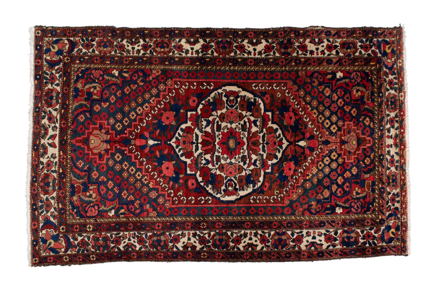 A Pakistani Persian Design Wool Rug 7 feet 6 inches x 4 feet 8 inches. — 20TH CENTURY