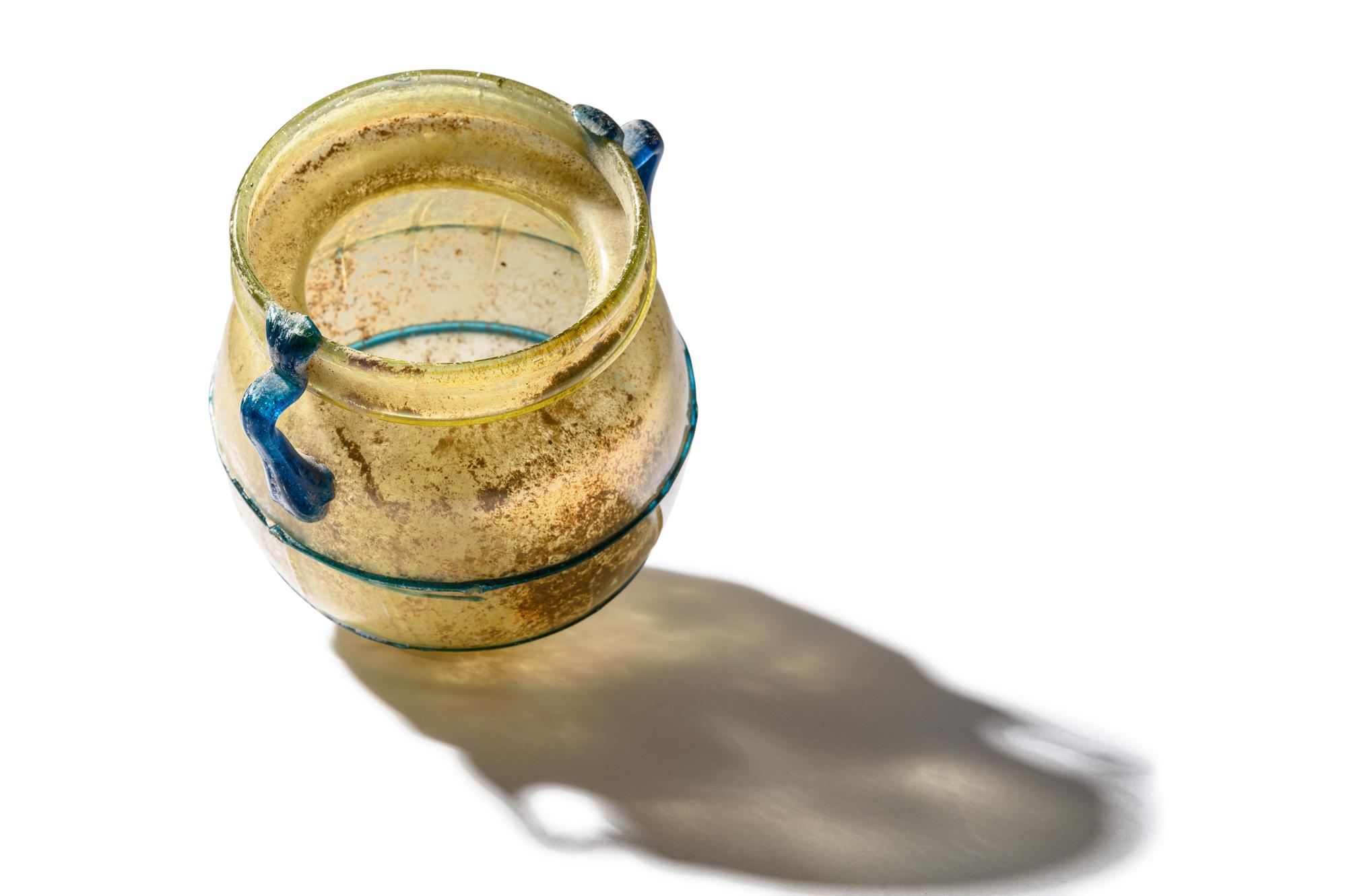 A Roman Yellow Glass Jar with Blue Spiral Trail