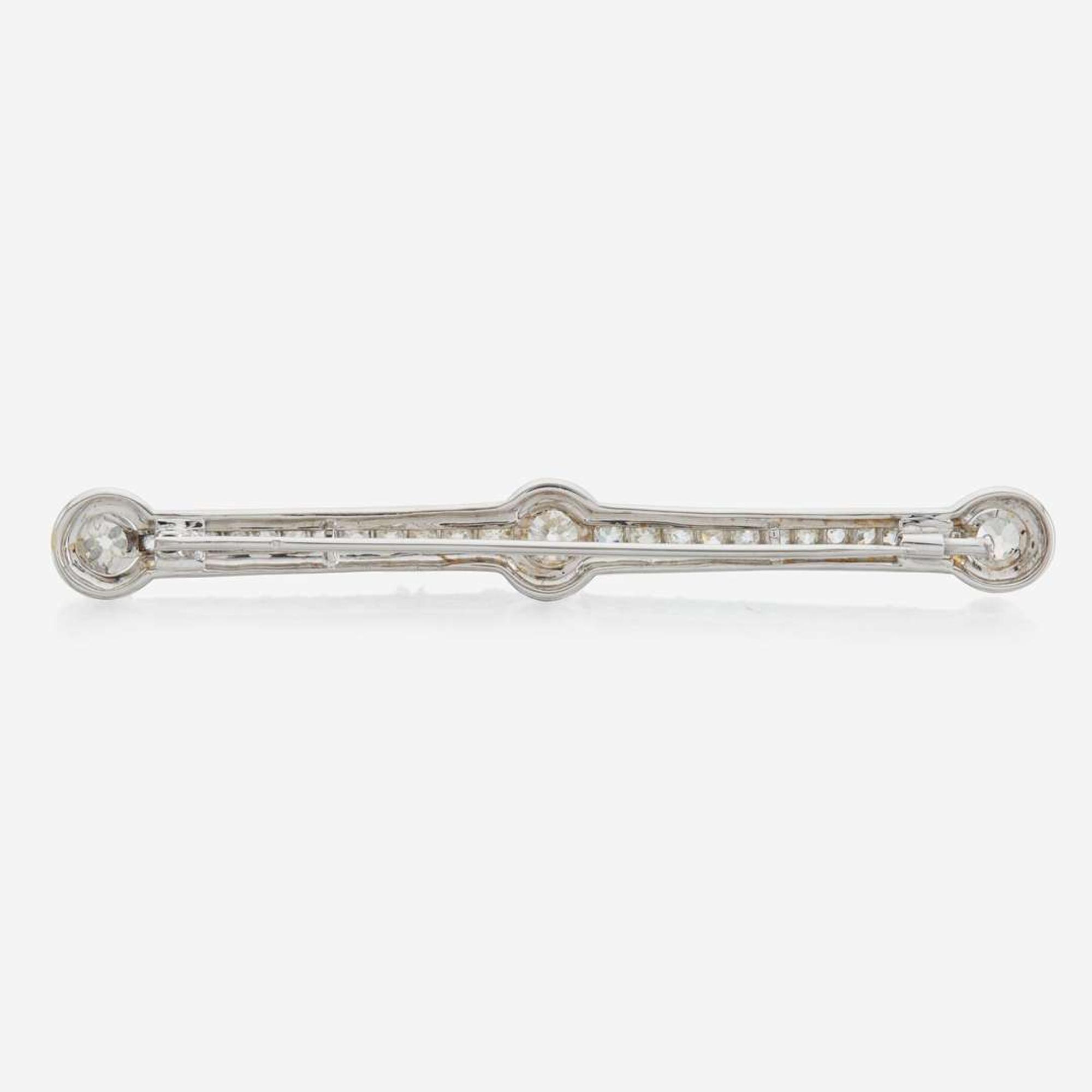 A diamond and white gold brooch