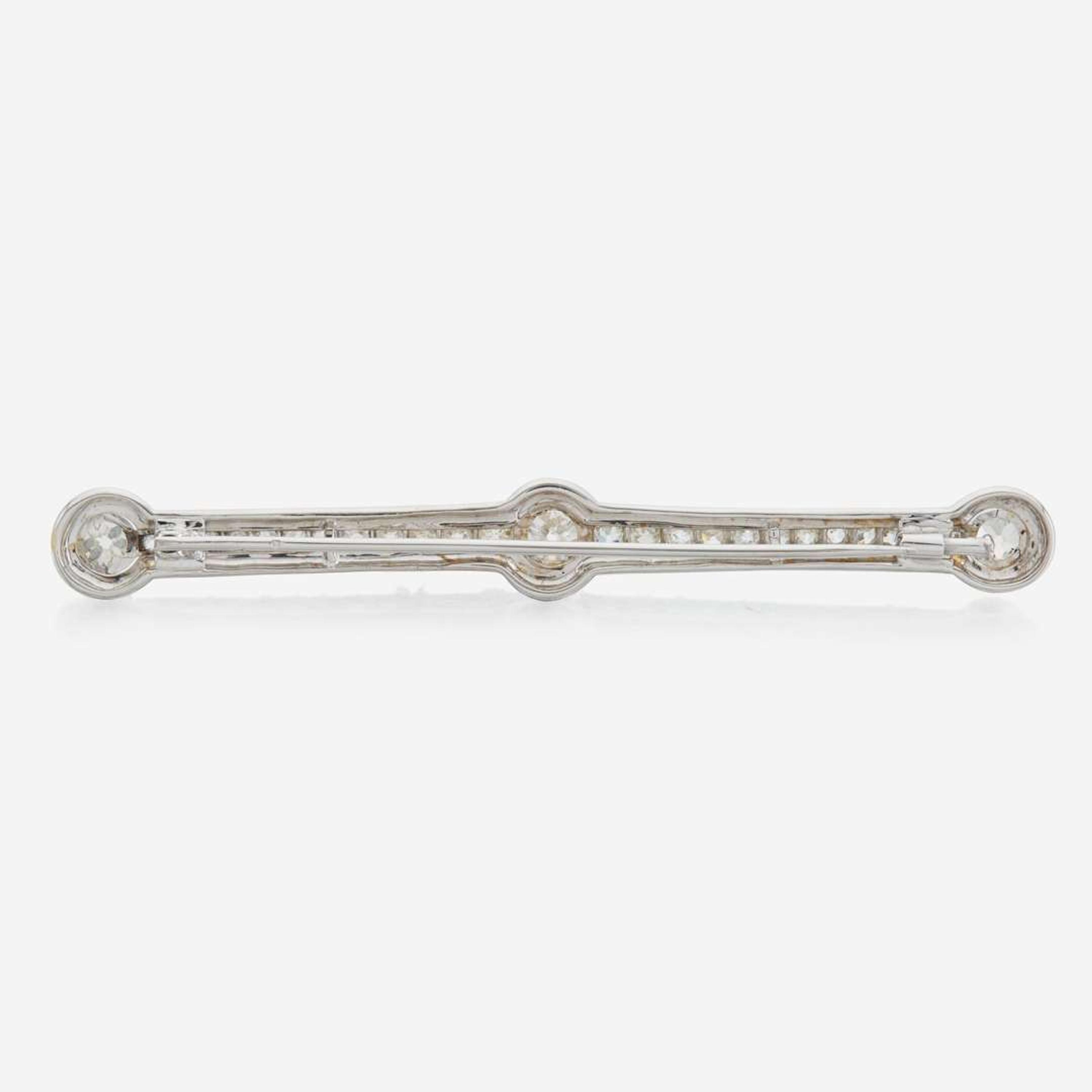 A diamond and white gold brooch