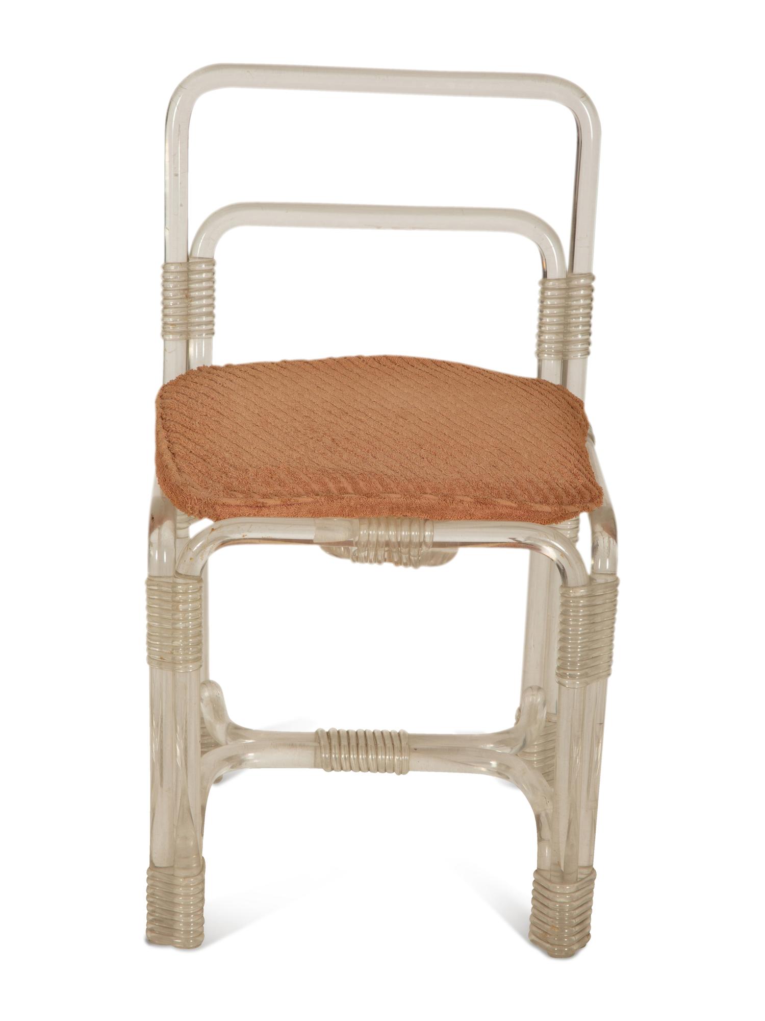 A Pair of Tubular Acrylic Low Back Chairs