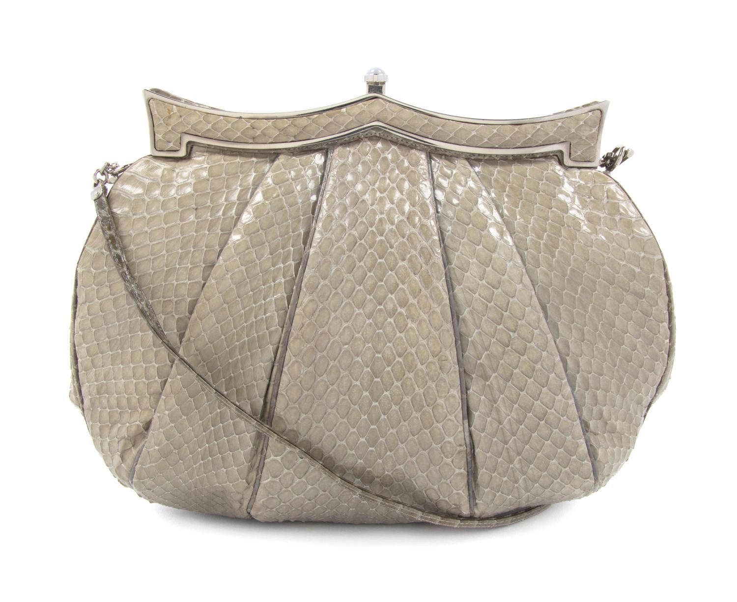 A Judith Leiber Sage Karung Snakeskin Bag, 9 1/2 x 8 x 1 inches.