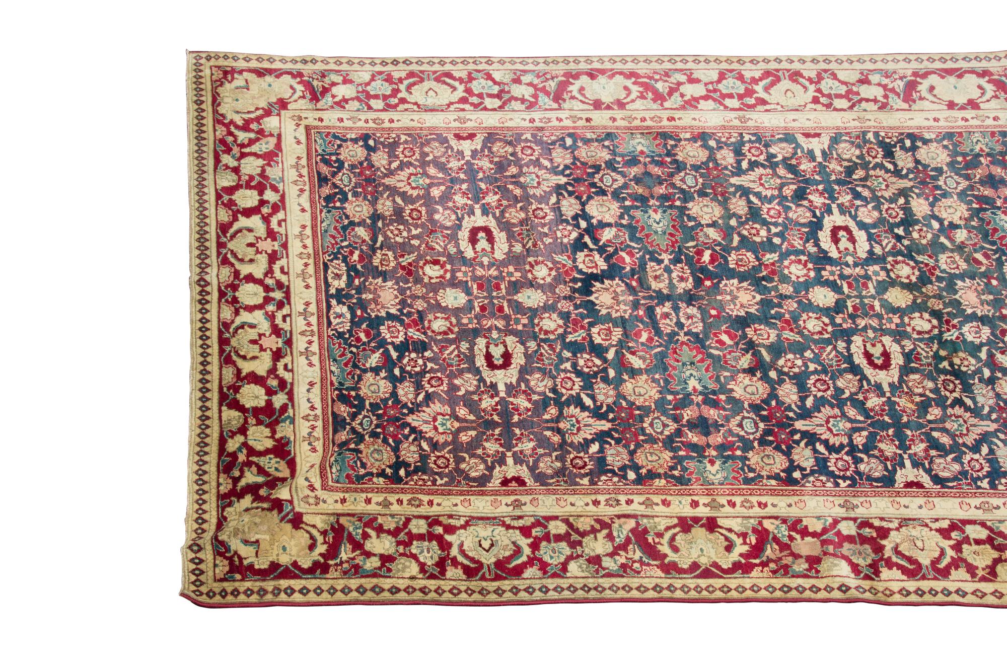 An Agra Gallery Carpet 12 feet x 5 feet. — 20TH CENTURY