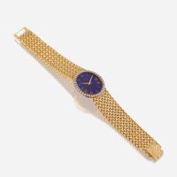 An eighteen karat gold, lapis lazuli, and diamond bracelet wristwatch, Piaget
