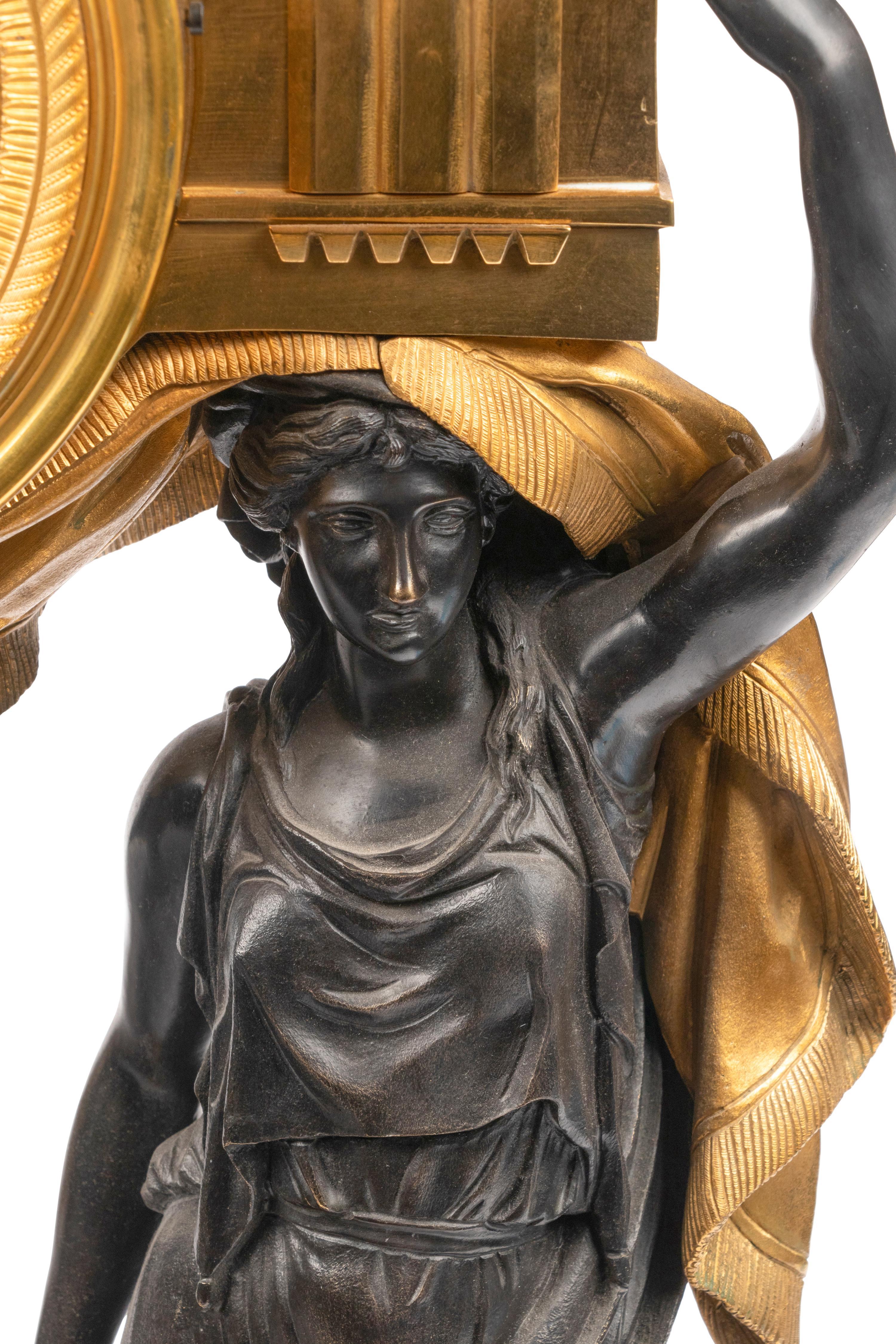 A Large French Gilt and Patinated Bronze and Rouge Marble Three-Piece Clock Garniture