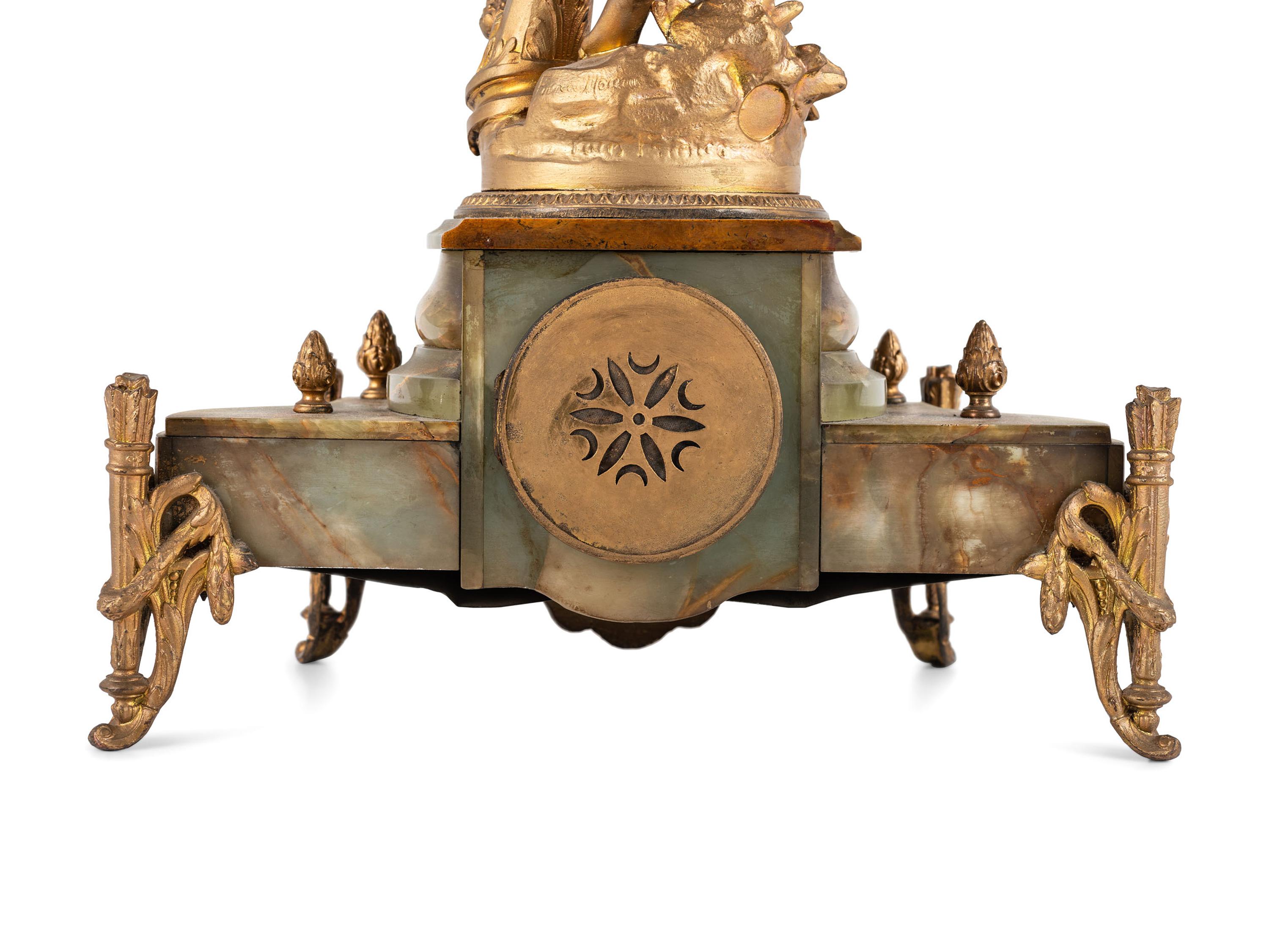A Neoclassical Gilt Metal and Onyx Clock Garniture