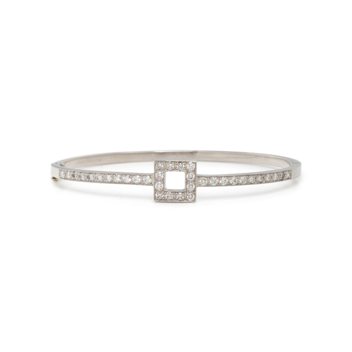 TIFFANY & CO., PLATINUM AND DIAMOND BANGLE BRACELET