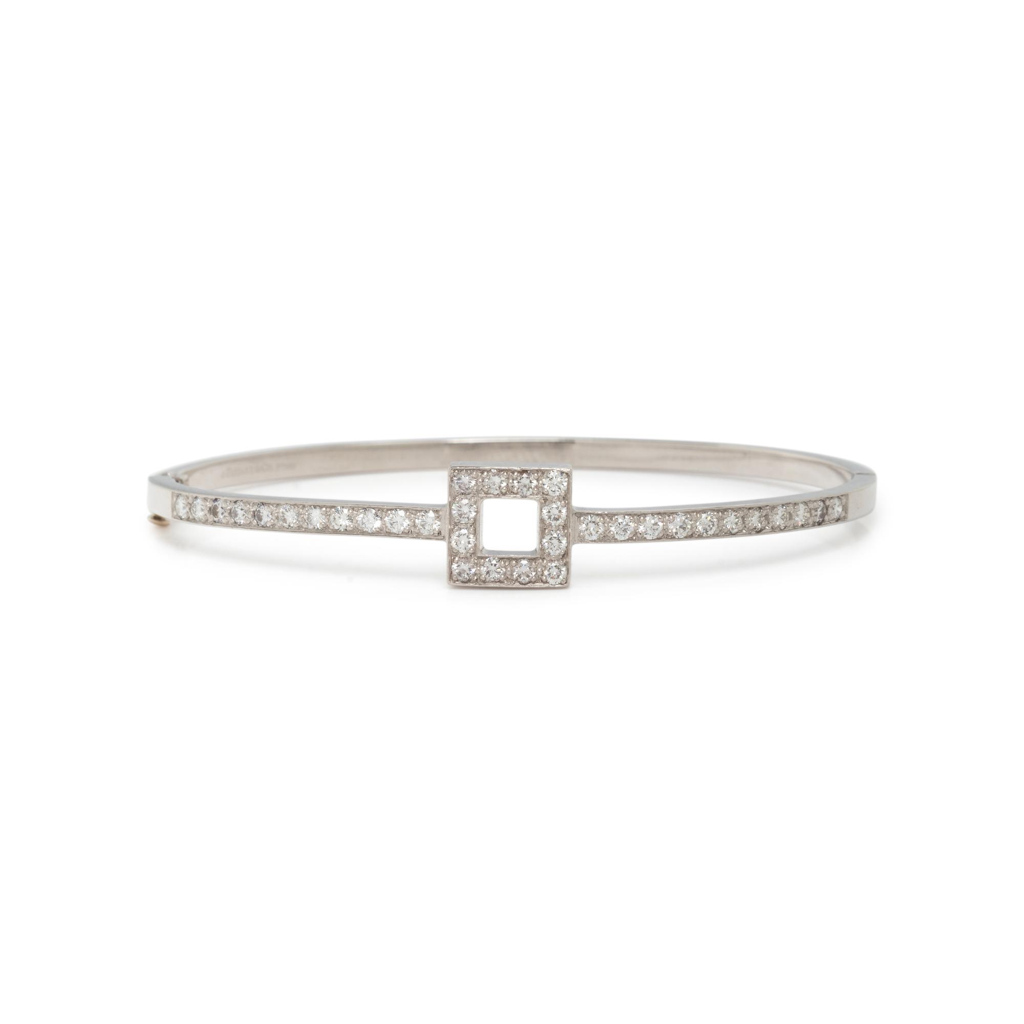 TIFFANY & CO., PLATINUM AND DIAMOND BANGLE BRACELET