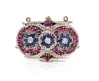 An 18 Karat White Gold, Sapphire, Ruby and Diamond Multi Strand Clasp, 8.00 dwts.