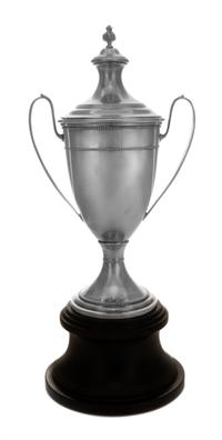 An American Silver Trophy, M. Fred Hirsch Co., Jersey City, NJ, of two handled baluster form surmounted by a foliate finial and raised