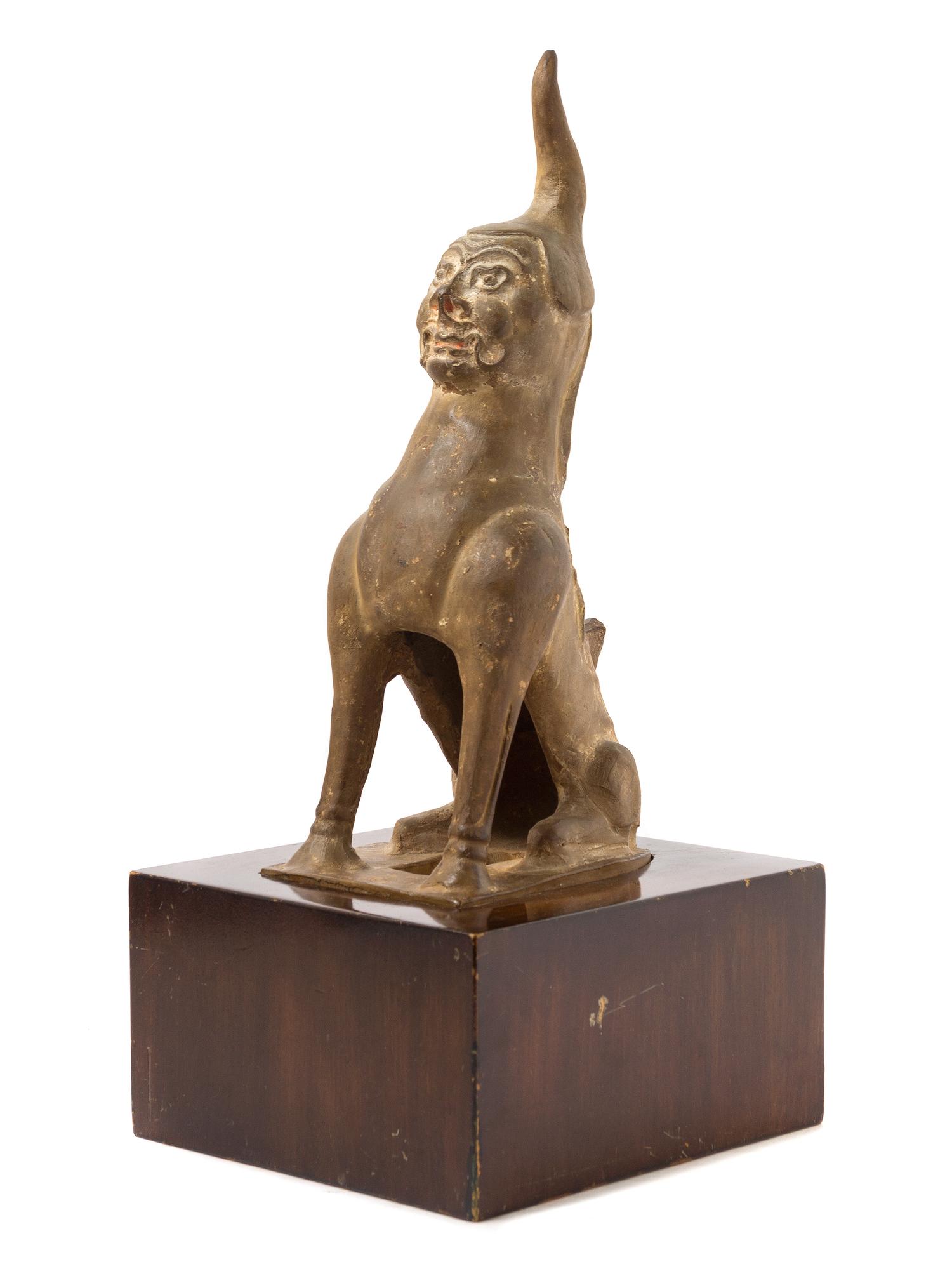 A Chinese Earthenware Figure of an Earth Spirit TANG DYNASTY Height of figure 13 1/2 inches. — TANG DYNASTY