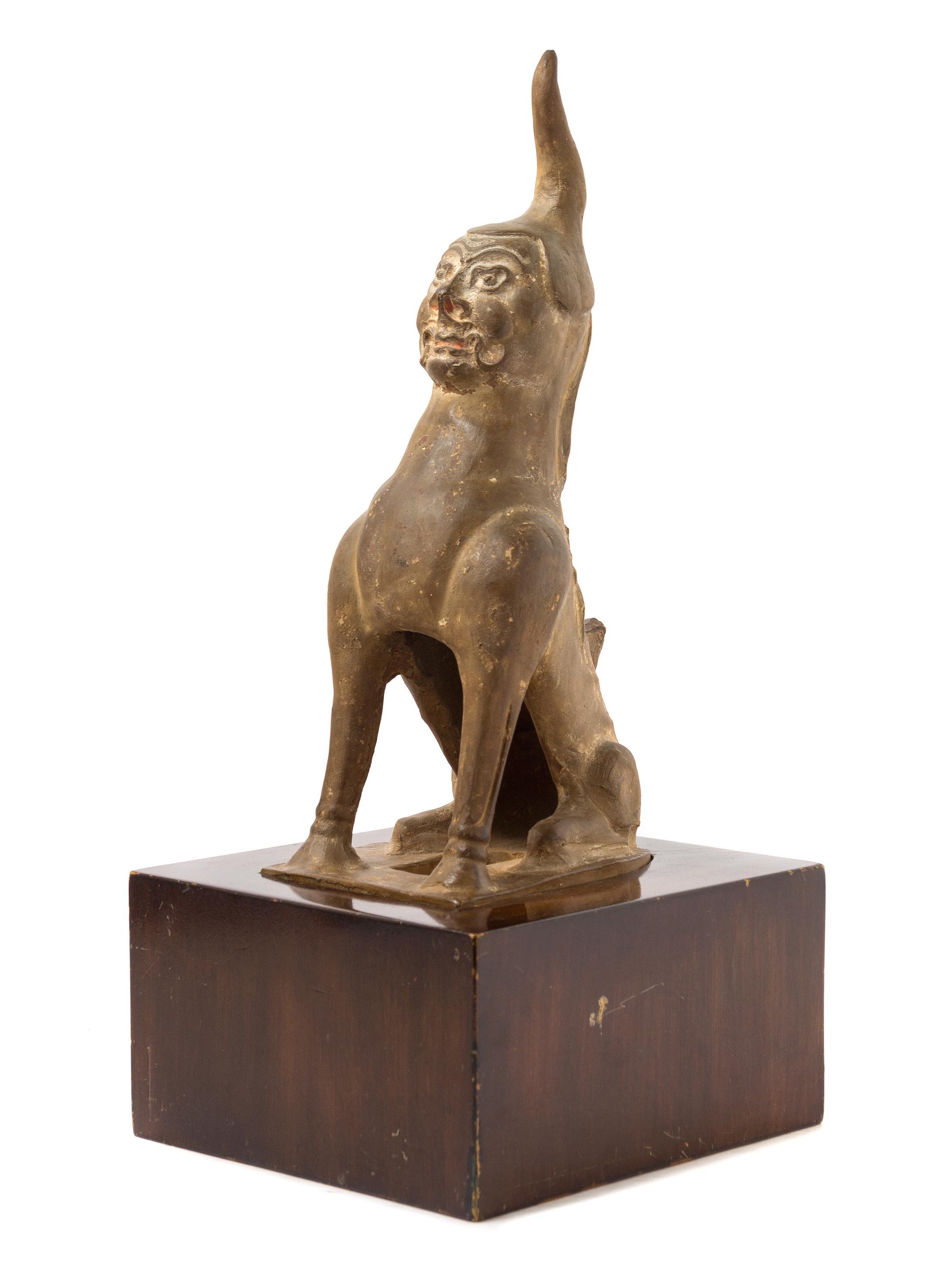 A Chinese Earthenware Figure of an Earth Spirit TANG DYNASTY Height of figure 13 1/2 inches. — TANG DYNASTY