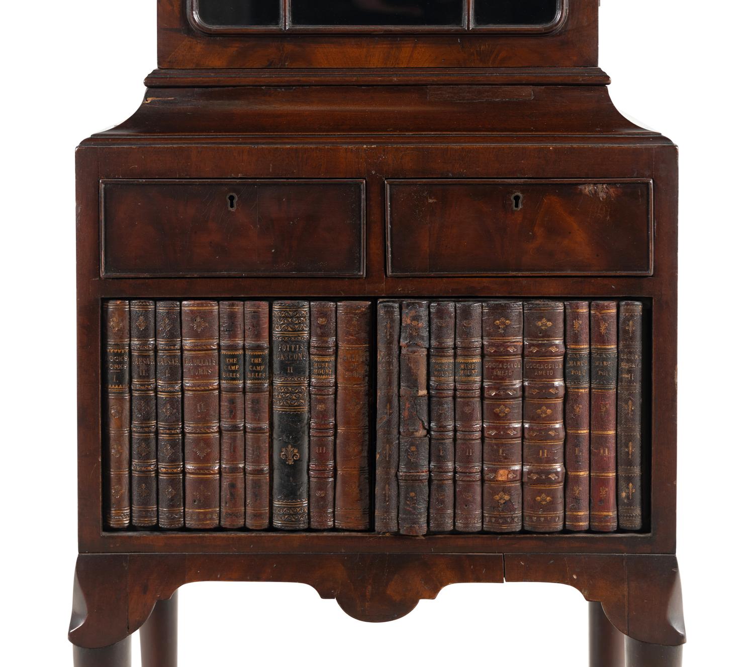 A Regency Mahogany and Faux-Book Decorated Vitrine Cabinet on Stand