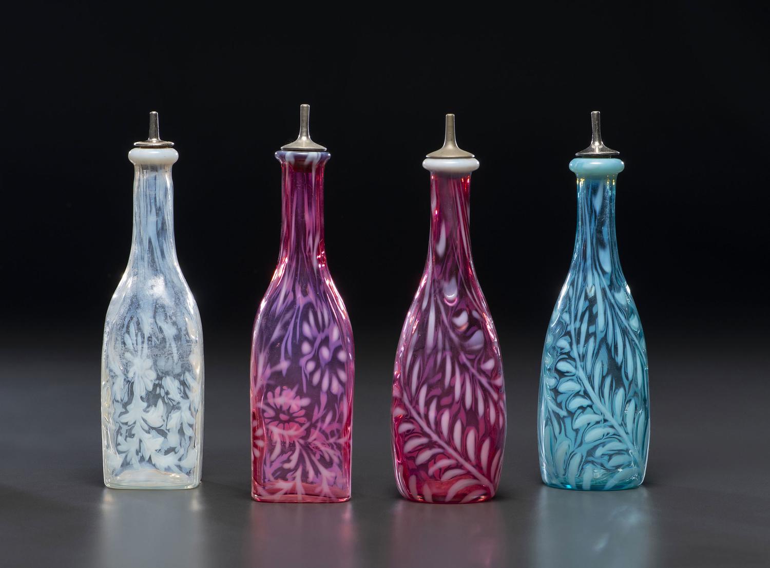 Four Fern Opalescent Glass Barber's Bottles