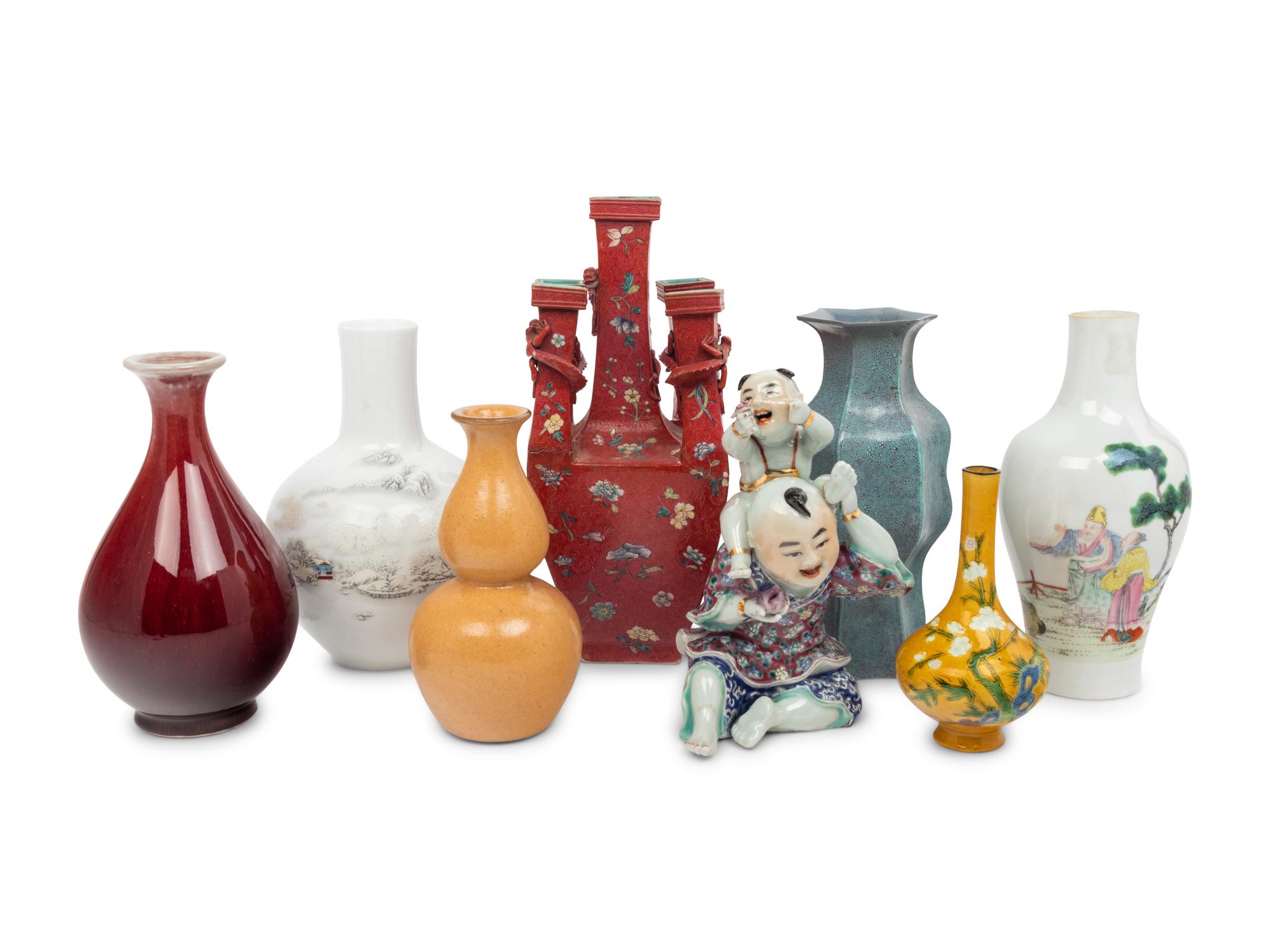 Seven Chinese Porcelain Vases and A Chinese Famille Rose Porcelain Figures