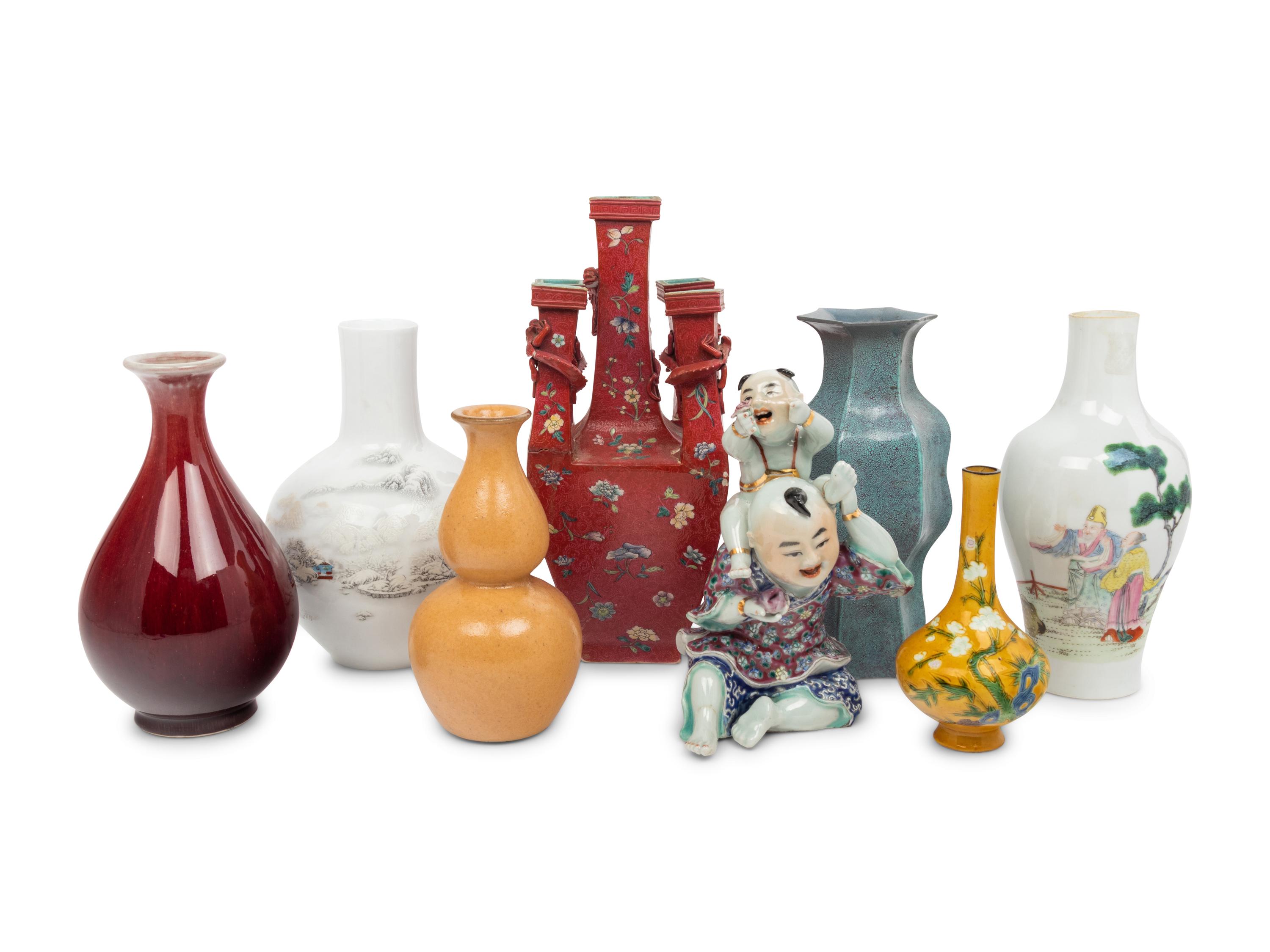 Seven Chinese Porcelain Vases and A Chinese Famille Rose Porcelain Figures