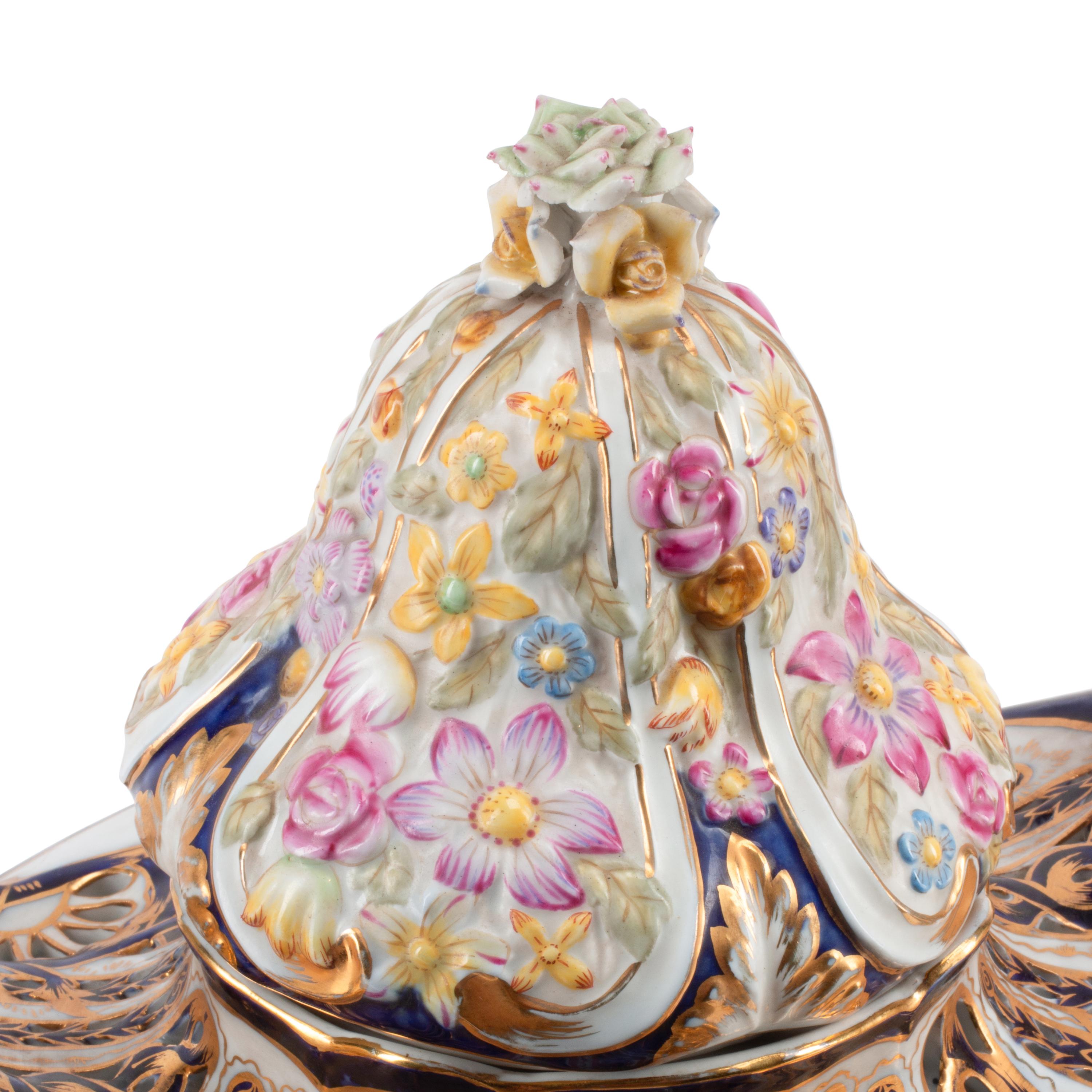A Pair of Sèvres Style Porcelain Potpourri Vases and Covers