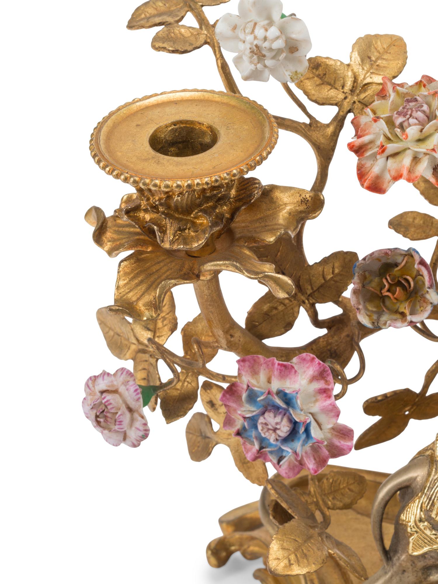 A Pair of Louis XV Style Gilt Bronze, Silvered Bronze and Porcelain Candelabra
