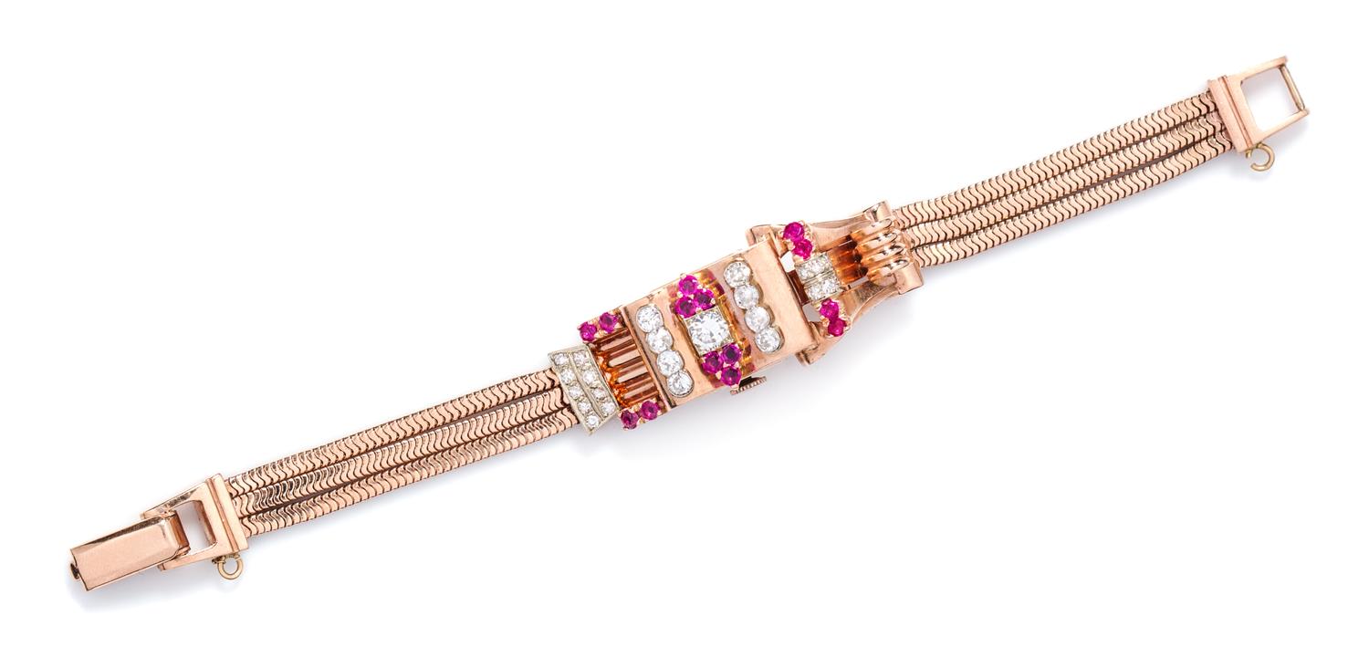 A Rose Gold, Ruby and Diamond Surprise Wristwatch, 25.90 dwts.