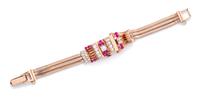 A Rose Gold, Ruby and Diamond Surprise Wristwatch, 25.90 dwts.