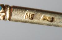 A Russian Silver-Gilt and Enamel Spoon, Mark of D. Nikitin, Moscow, early 20th century, having a polychrome enamel finial on a twist ha